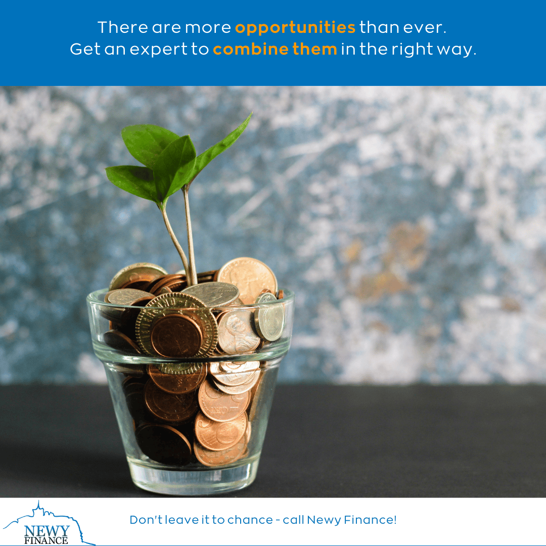 Glass full of loose change with a small plant sprouting from it